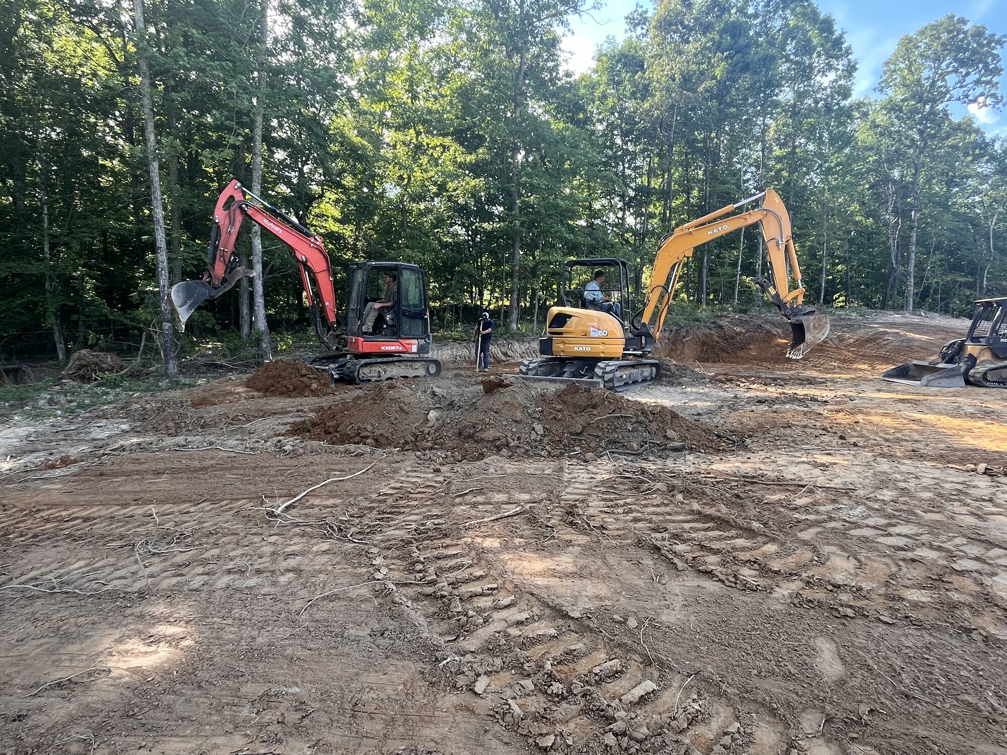 Site Prep — Two-machine site prep for a new build Two excavators on site prep for a new build near Selmer TN