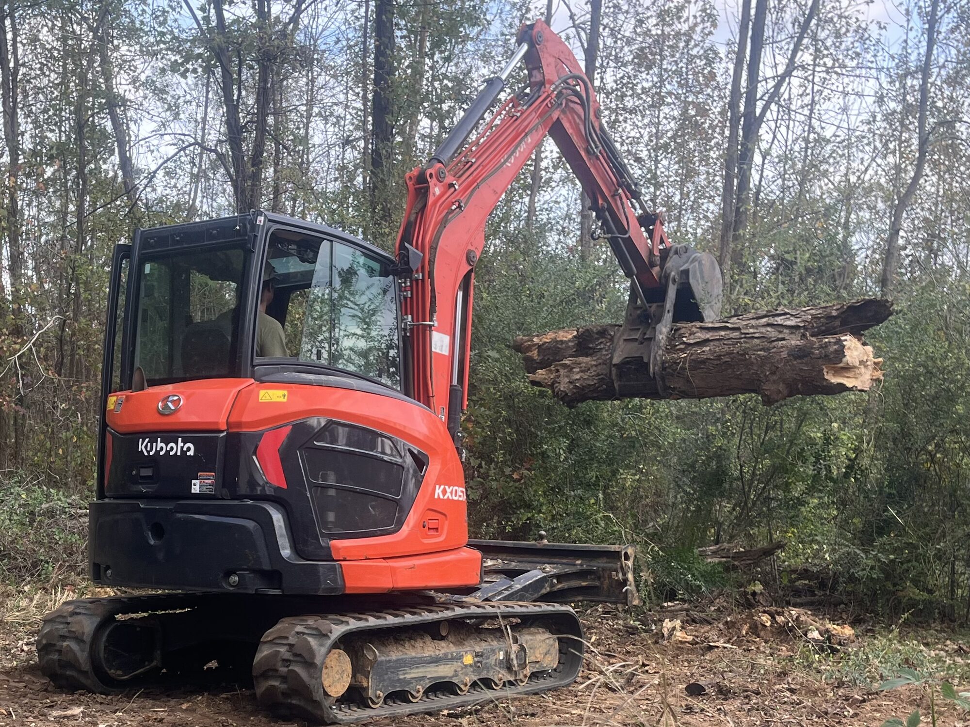Tree Removal — Hauling out a downed trunk with the KX057 Hauling a downed trunk with excavator in McNairy County TN