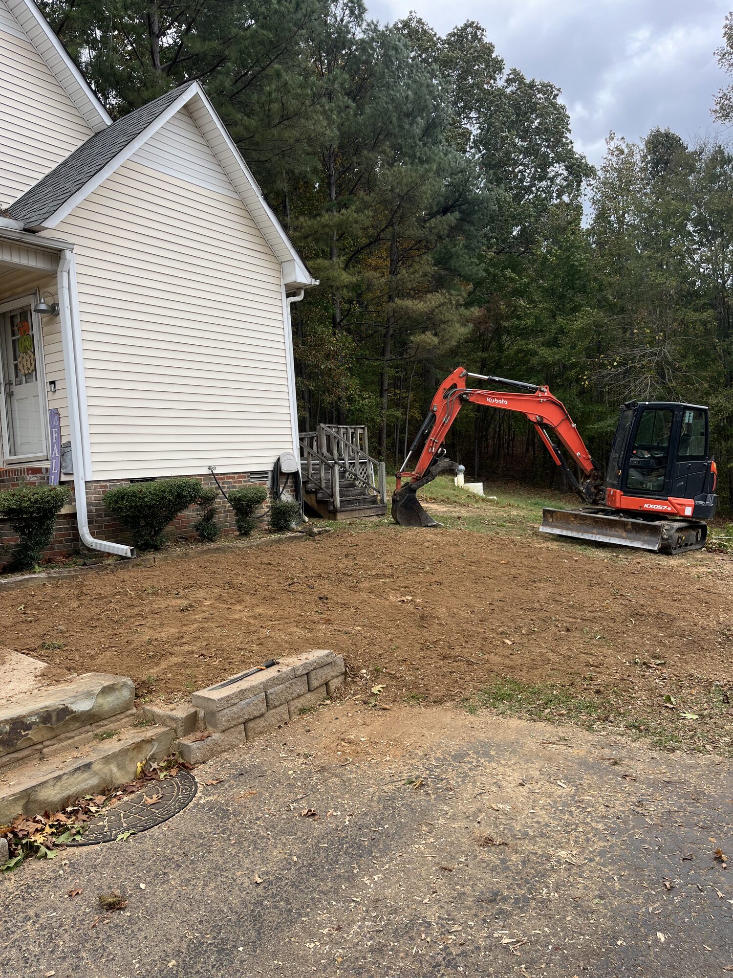 Dirt Work — Final grade pulled in around the home Final dirt grade around a home in Selmer TN